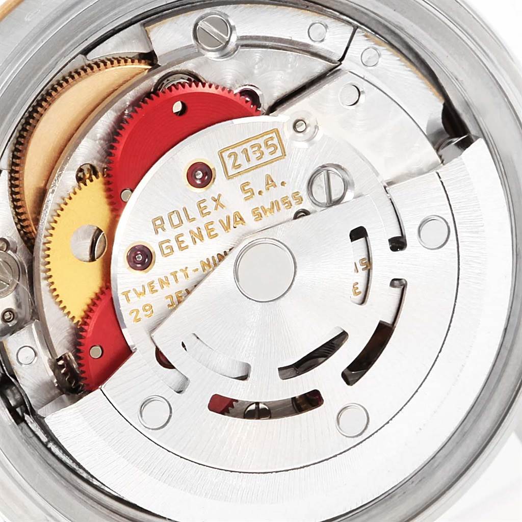 This image shows the movement mechanism of a Rolex Datejust 69173 Women's Stainless Steel Champagne Dial 69173 Women's Stainless Steel Champagne Dial watch, highlighting gears and the rotor.