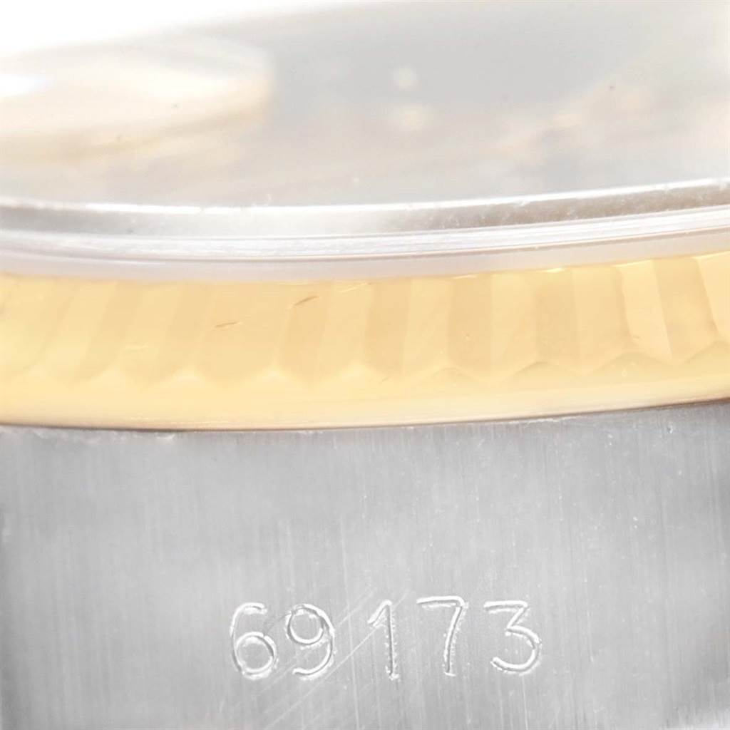 This image shows a close-up of the model number "69173" on the case side and part of the bezel of a Rolex Datejust 69173 Women's Stainless Steel Champagne Dial 69173 Women's Stainless Steel Champagne Dial.