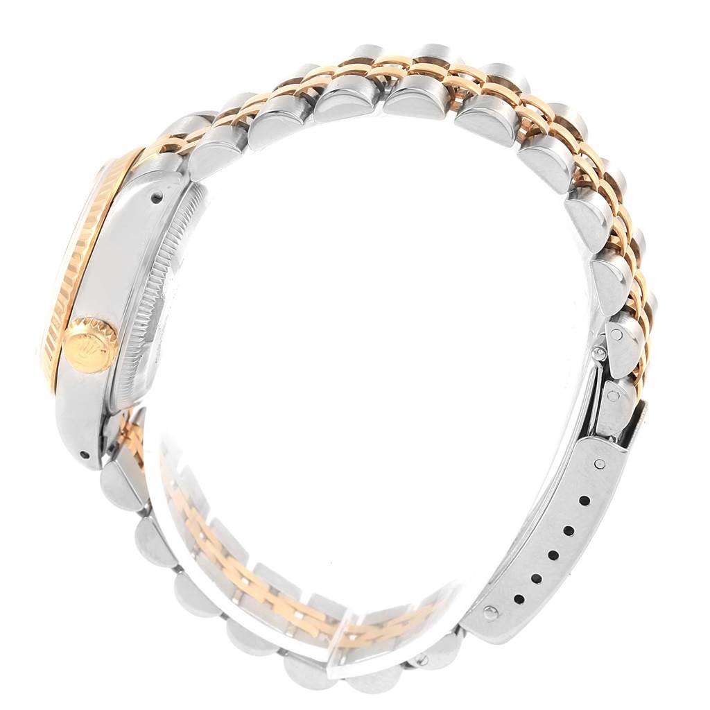 Side view of the Rolex Datejust 69173 Women's Stainless Steel White Dial 69173 Women's Stainless Steel White Dial watch showing the crown, case, and two-tone bracelet.