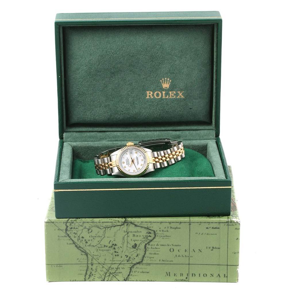 The Rolex Datejust 69173 Women's Stainless Steel White Dial 69173 Women's Stainless Steel White Dial watch is shown from the front, presented in an open green box with the Rolex logo inside.