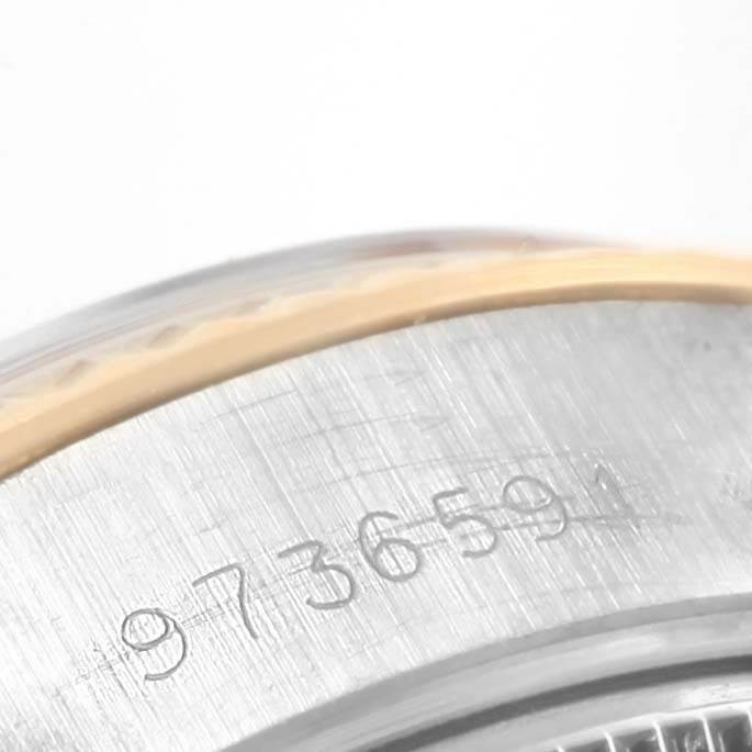 This image shows a close-up of the serial number engraved on the case of a Rolex Datejust 69173 Women's Stainless Steel White Dial 69173 Women's Stainless Steel White Dial watch.