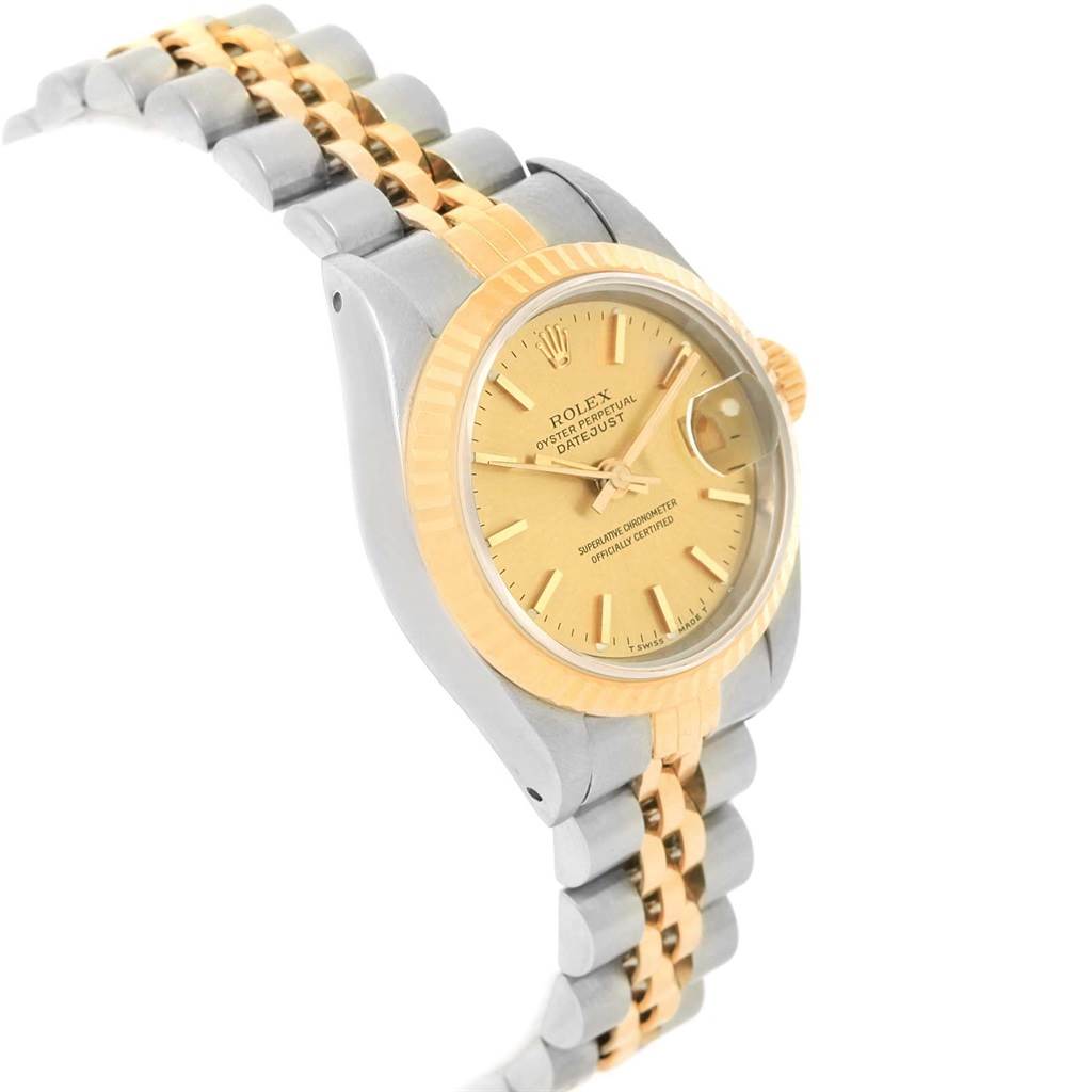 This image shows a side angle of a Rolex Datejust 69173 Women's Stainless Steel Champagne Dial 69173 Women's Stainless Steel Champagne Dial watch, highlighting its gold and silver bracelet, gold bezel, and face with date window.
