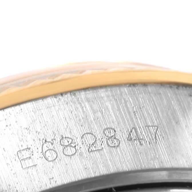 This close-up image shows the serial number engraving on the side of a Rolex Datejust 69173 Women's Stainless Steel Champagne Dial 69173 Women's Stainless Steel Champagne Dial watch case.