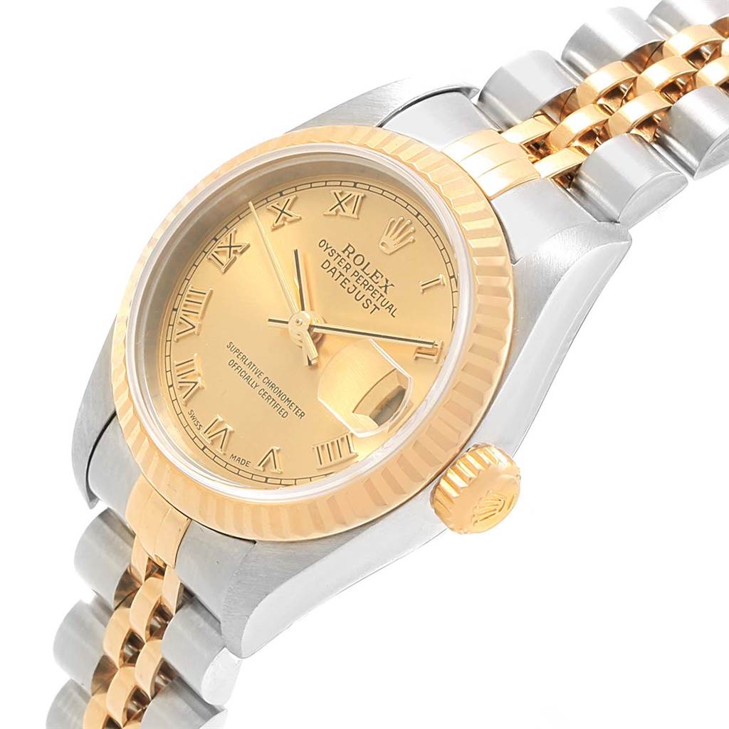 The Rolex Datejust 79173 Women's Steel and Gold (two tone) Champagne Dial 79173 Women's Steel and Gold (two tone) Champagne Dial watch is shown from an angled view displaying the dial, bezel, case, and part of the bracelet.