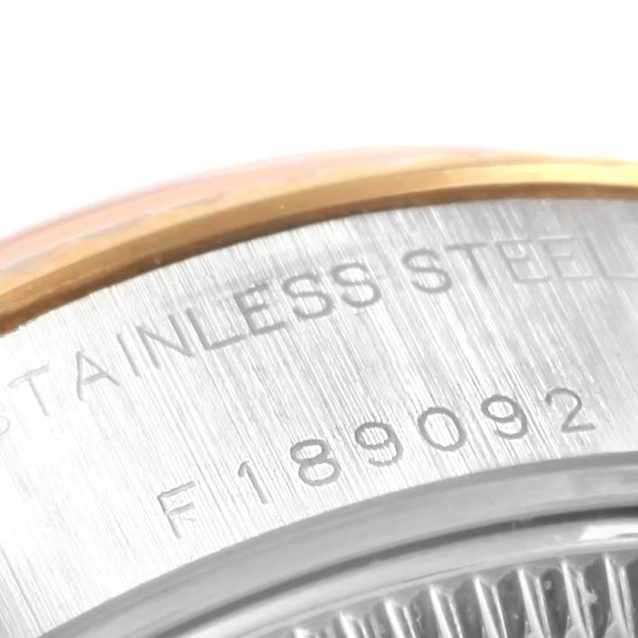 This image shows a close-up of the case back of a Rolex Datejust 79173 Women's Steel and Gold (two tone) Champagne Dial 79173 Women's Steel and Gold (two tone) Champagne Dial, highlighting the engraving with the serial number and "STAINLESS STEEL."
