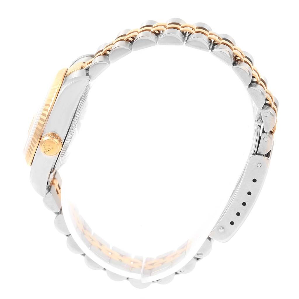 This image shows a side view of the Rolex Datejust 79173 Women's Steel and Gold (two tone) Champagne Dial 79173 Women's Steel and Gold (two tone) Champagne Dial watch, highlighting its case, crown, and two-tone bracelet.