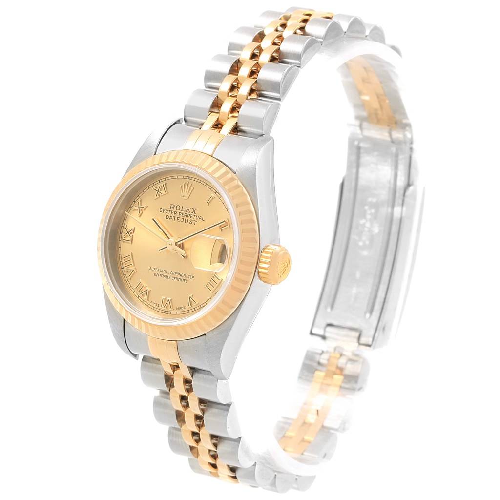 This image shows a side angle view of a Rolex Datejust 79173 Women's Steel and Gold (two tone) Champagne Dial 79173 Women's Steel and Gold (two tone) Champagne Dial watch, featuring the face, fluted bezel, crown, and two-tone bracelet.