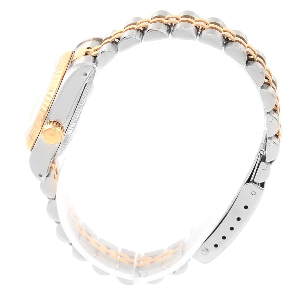 This image shows a side view of a Rolex Datejust 69173 Women's Stainless Steel Champagne Dial 69173 Women's Stainless Steel Champagne Dial watch, highlighting the crown, case, and two-tone bracelet.