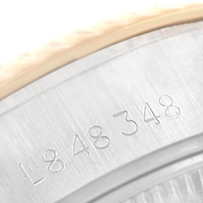 This is a close-up image of the serial number engraved on the case back of a Rolex Datejust 69173 Women's Stainless Steel Champagne Dial 69173 Women's Stainless Steel Champagne Dial watch.