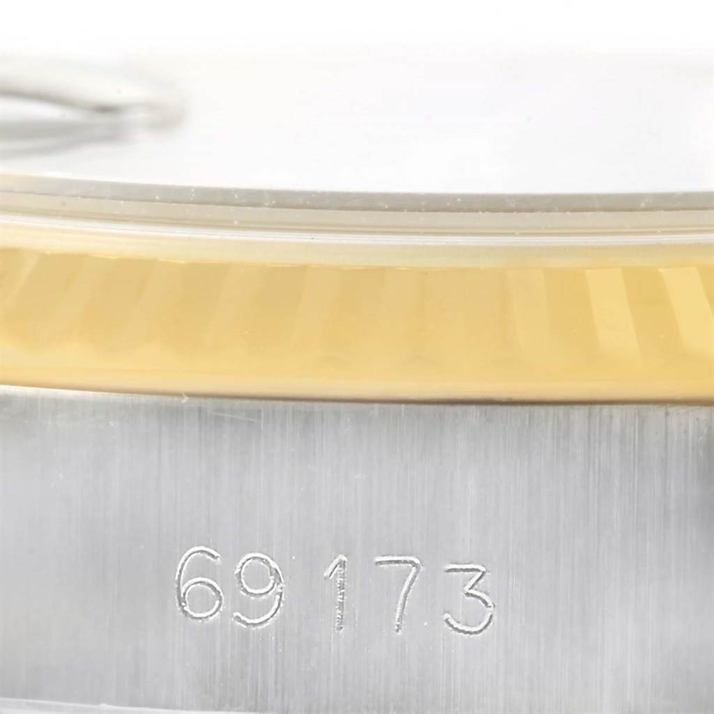 This image shows a close-up side view of the casing and bezel of a Rolex Datejust 79173 Women's Steel and Gold (two tone) Champagne Dial 79173 Women's Steel and Gold (two tone) Champagne Dial model watch, with the model number 69173 visible.