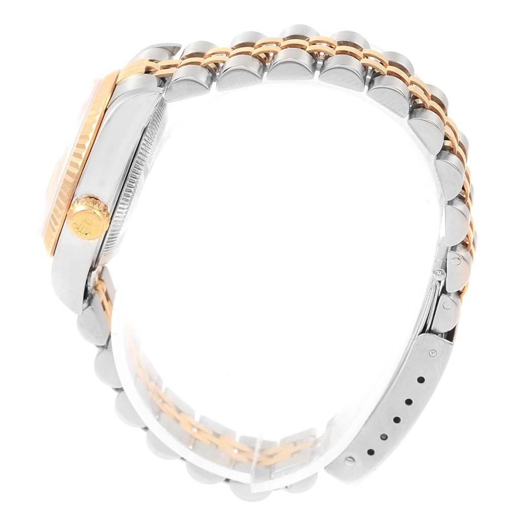 The image shows a side view of the Rolex Datejust 79173 Women's Steel and Gold (two tone) Champagne Dial 79173 Women's Steel and Gold (two tone) Champagne Dial watch, highlighting the crown, case, and a partial bracelet.