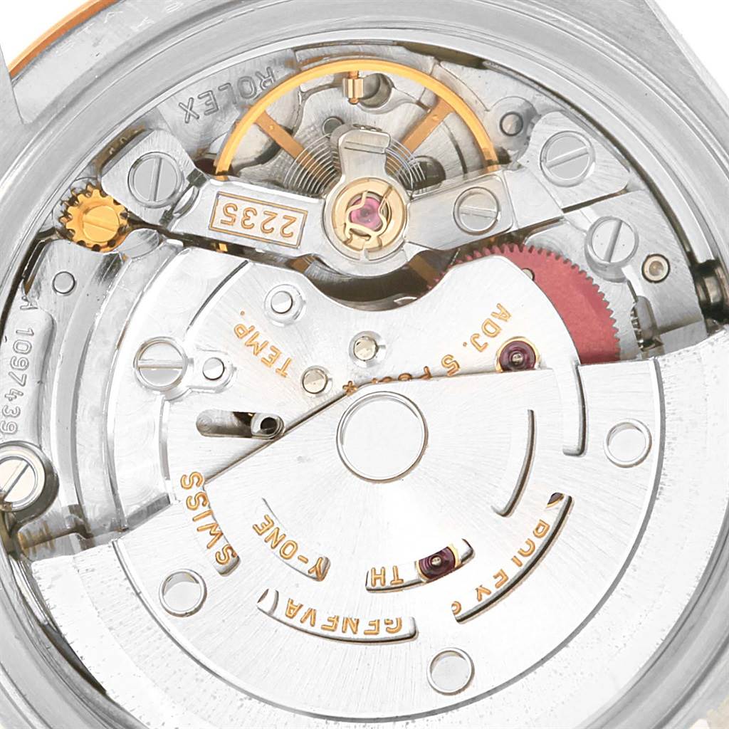 This image shows a close-up view of the inside mechanism of a Rolex Datejust 79173 Women's Steel and Gold (two tone) Champagne Dial 79173 Women's Steel and Gold (two tone) Champagne Dial watch, highlighting intricate components such as gears and the balance wheel.