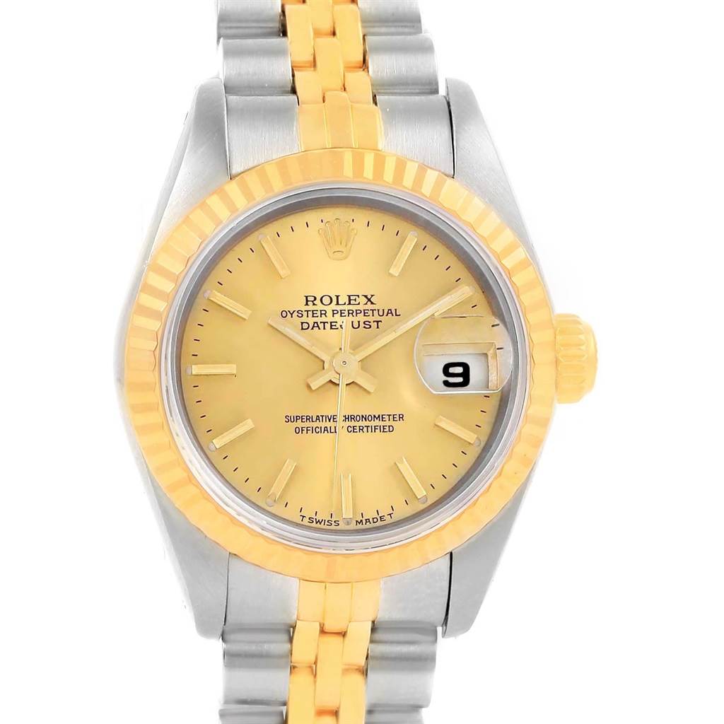 This image shows the front view of a Rolex Datejust 79173 Women's Steel and Gold (two tone) Champagne Dial 79173 Women's Steel and Gold (two tone) Champagne Dial watch, depicting the dial, hands, date window, bezel, and part of the bracelet.
