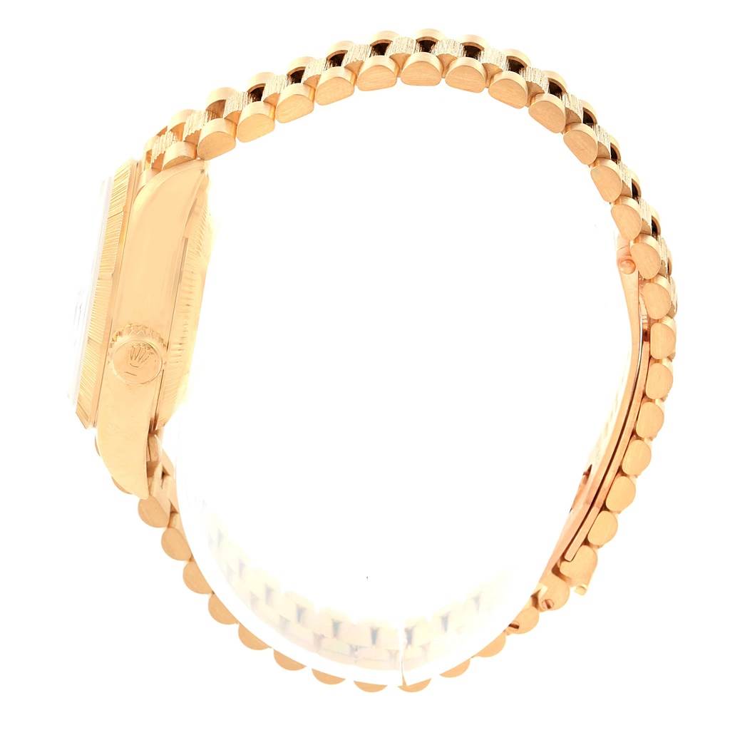 The image shows a Rolex Datejust 69278 Women's Yellow Gold Mother of Pearl Dial 69278 Women's Yellow Gold Mother of Pearl Dial watch from a side angle, highlighting the watch's case and bracelet.