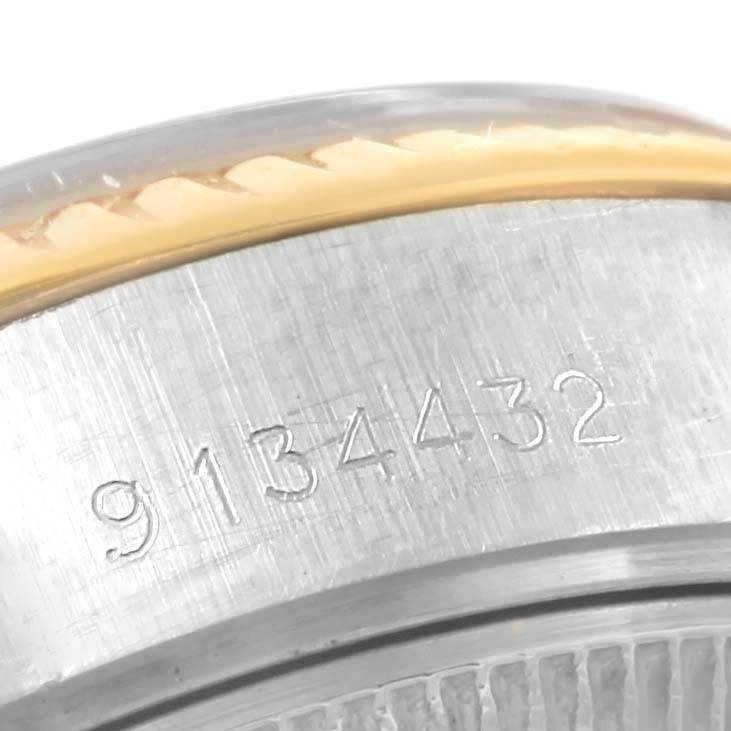 This image shows a close-up of the serial number engraved on the case side of a Rolex Datejust 69173 Women's Stainless Steel Champagne Dial 69173 Women's Stainless Steel Champagne Dial watch.