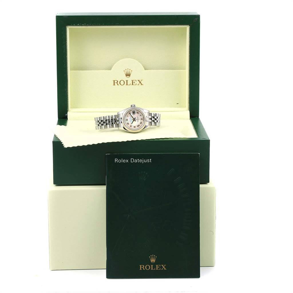 The Rolex Datejust 179174 Women's Stainless Steel Mother of Pearl Dial 179174 Women's Stainless Steel Mother of Pearl Dial watch is shown inside its open box with the manual placed in front.