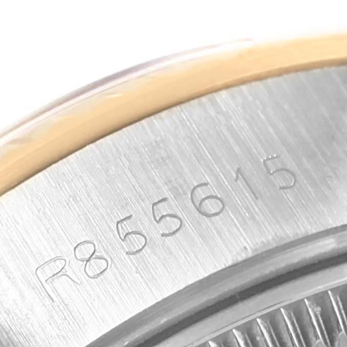 The image shows a close-up of the serial number engraved on the case of a Rolex Datejust 69173 Women's Stainless Steel White Dial 69173 Women's Stainless Steel White Dial watch.