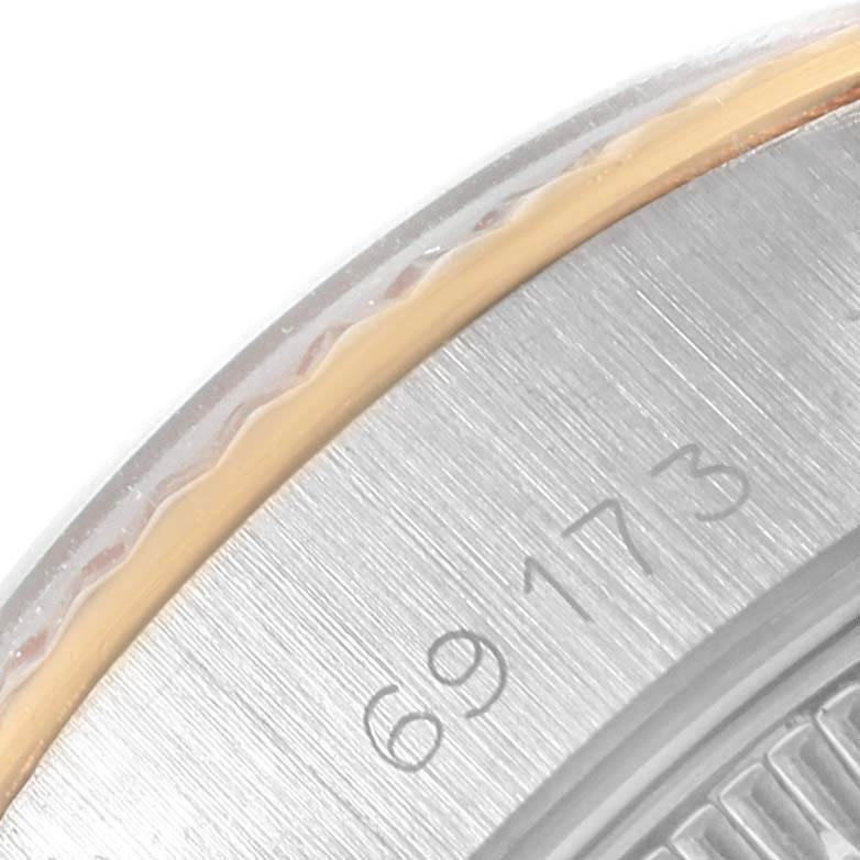 This image shows a close-up of the serial number and edge of the bezel on a Rolex Datejust 69173 Women's Stainless Steel White Dial 69173 Women's Stainless Steel White Dial watch.