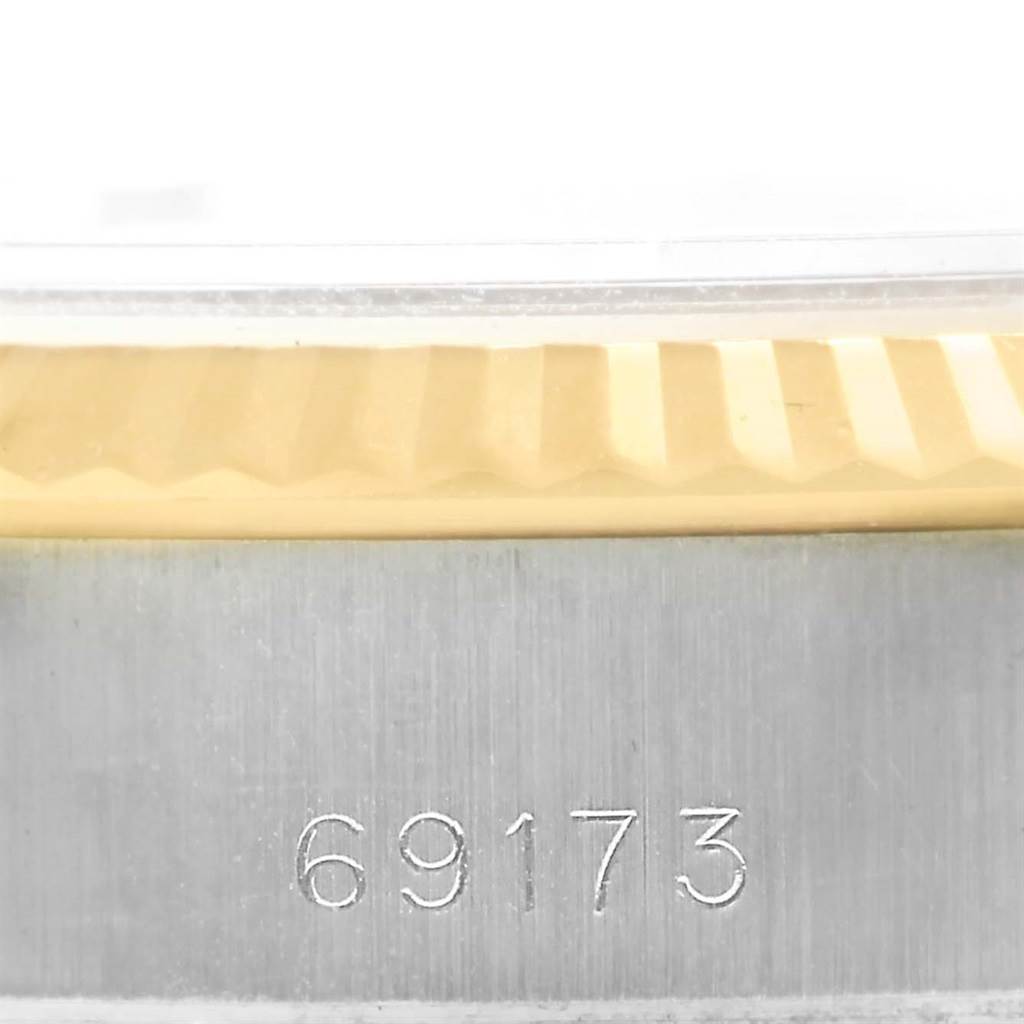 This close-up image shows the fluted bezel and engraved model number (69173) of the Rolex Datejust 69173 Women's Stainless Steel Champagne Dial 69173 Women's Stainless Steel Champagne Dial watch.