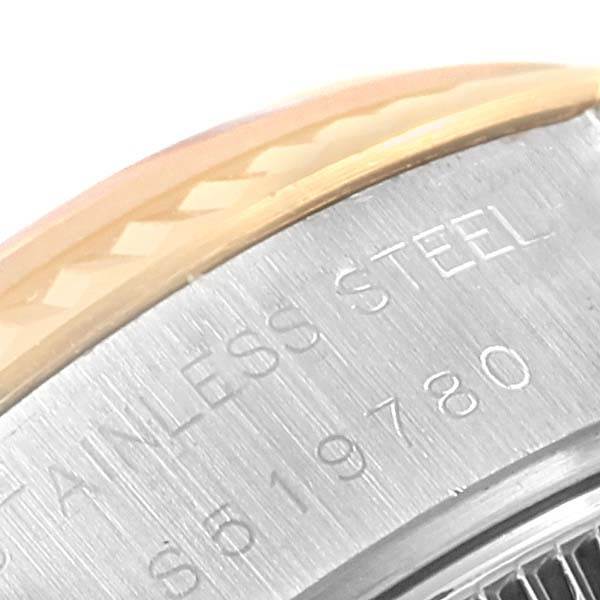 This close-up of the Rolex Datejust 69173 Women's Stainless Steel Blue Dial 69173 Women's Stainless Steel Blue Dial shows part of the bezel and the engraved "stainless steel" caseback.