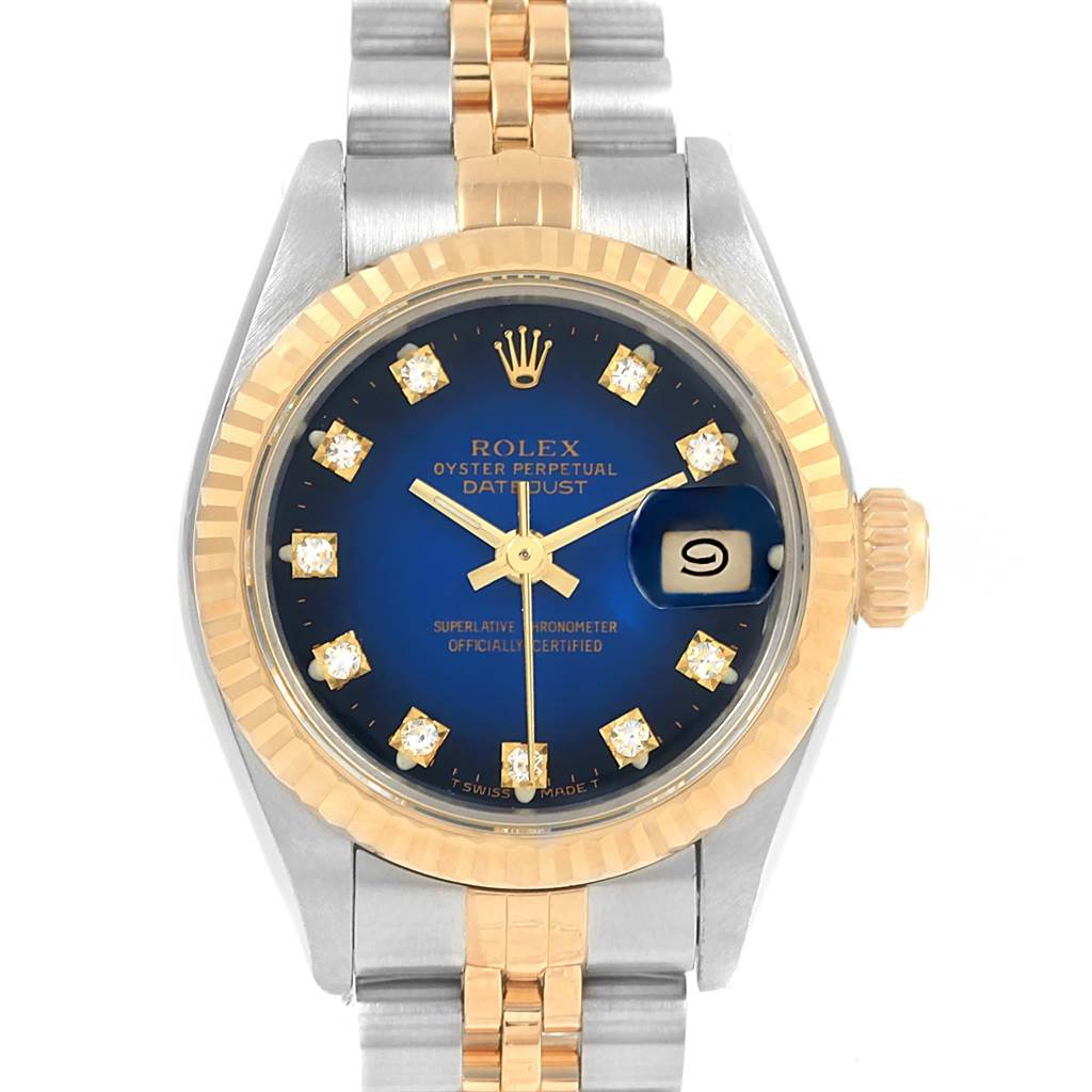 This Rolex Datejust 69173 Women's Stainless Steel Blue Dial 69173 Women's Stainless Steel Blue Dial watch is shown from a front angle, displaying its blue dial, gold fluted bezel, and two-tone bracelet.