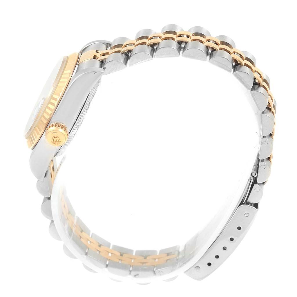 The image shows a side view of a Rolex Datejust 69173 Women's Stainless Steel Blue Dial 69173 Women's Stainless Steel Blue Dial watch, highlighting the bezel, crown, and two-tone bracelet.