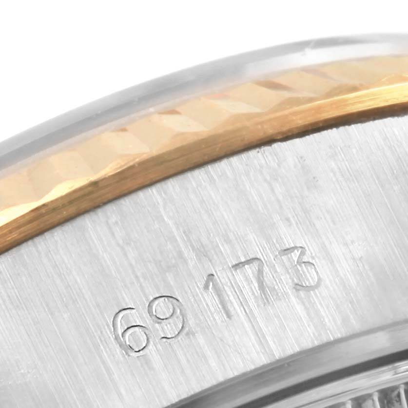 Close-up of the Rolex Datejust 69173 Women's Stainless Steel Champagne Dial 69173 Women's Stainless Steel Champagne Dial, showing part of the bezel and case with model number 69173 engraved.
