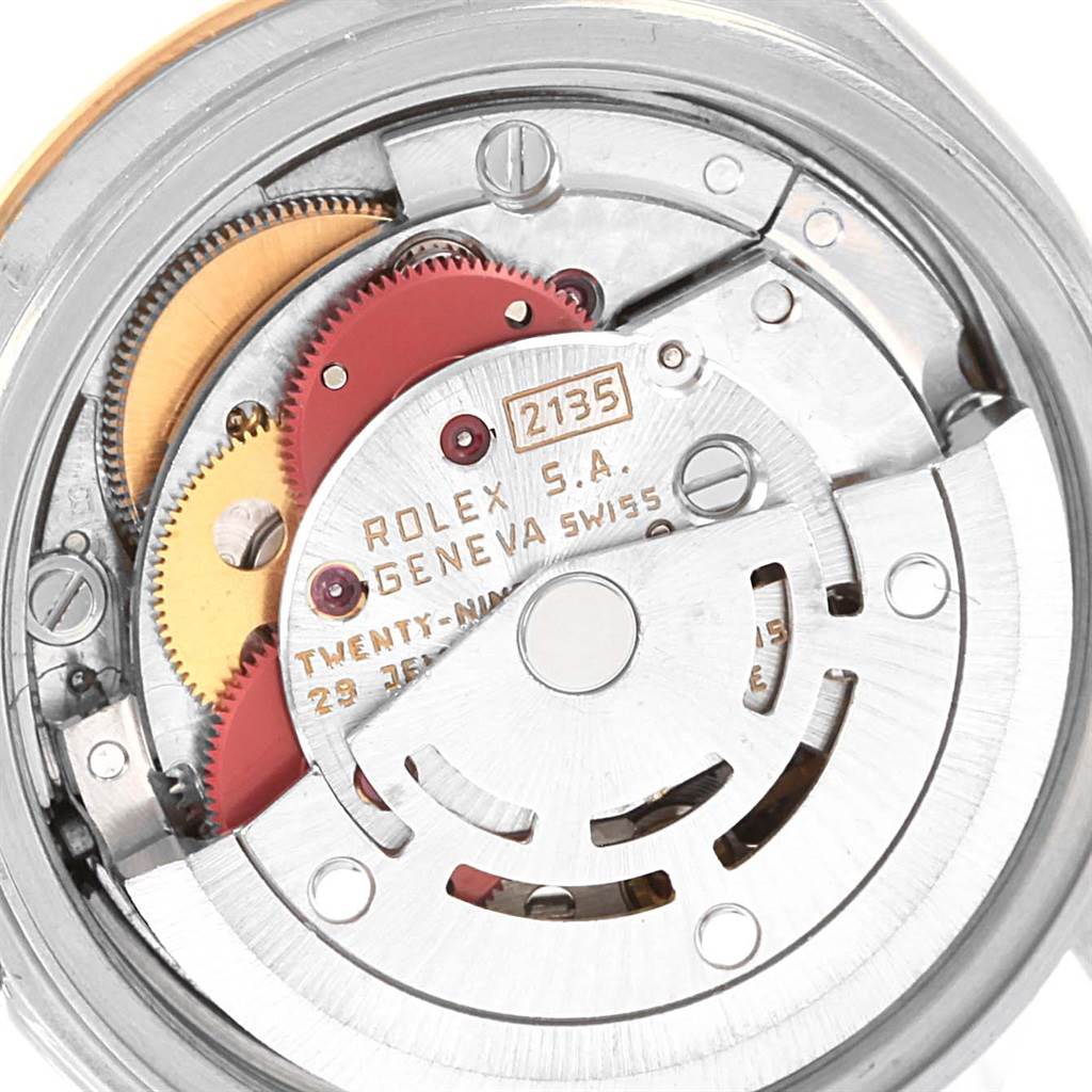 This image shows the internal movement mechanism of the Rolex Datejust 69173 Women's Stainless Steel Champagne Dial 69173 Women's Stainless Steel Champagne Dial watch, focusing on the gears and rotor.