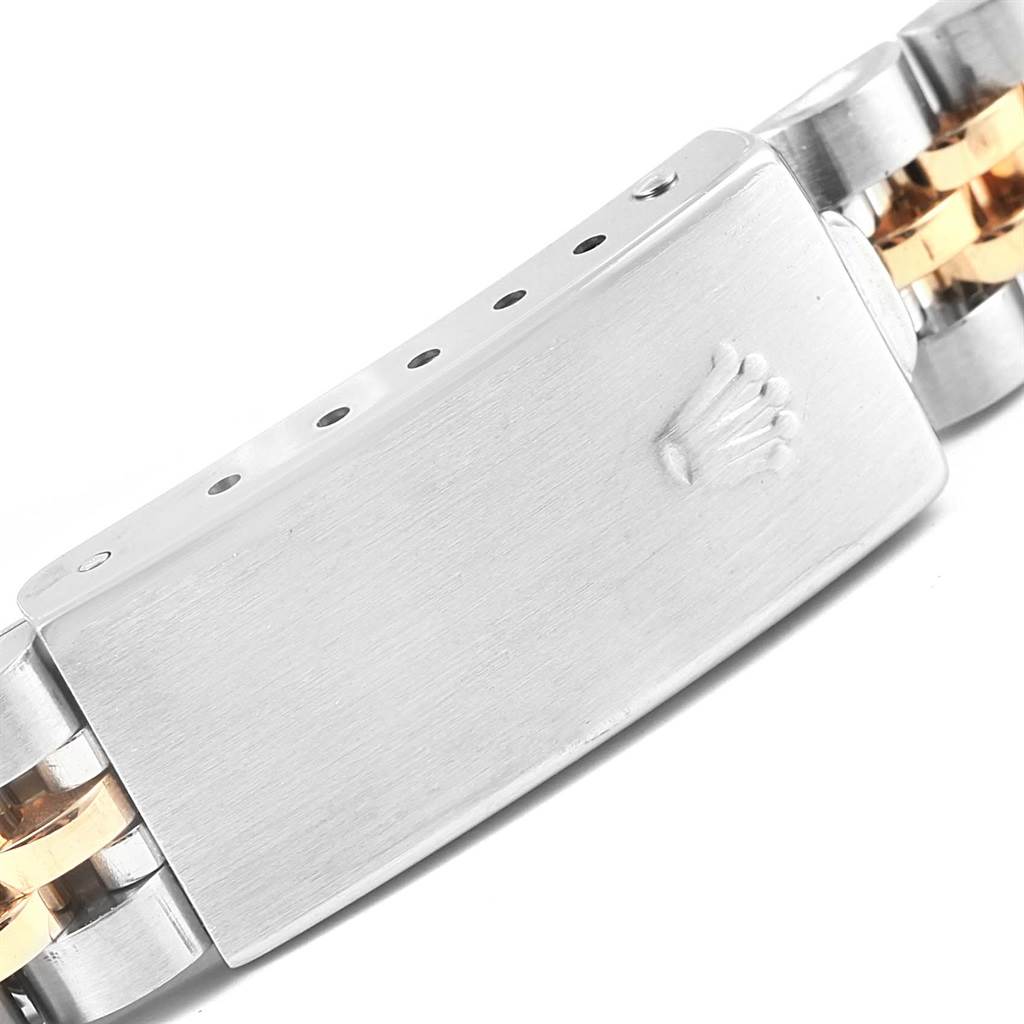This image shows the clasp of a Rolex Datejust 69173 Women's Stainless Steel Champagne Dial 69173 Women's Stainless Steel Champagne Dial watch, highlighting the brand's logo.