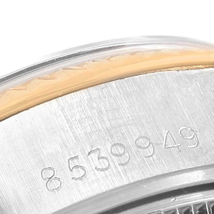 This close-up image shows the serial number engraving on the case back edge of a Rolex Datejust 69173 Women's Stainless Steel Champagne Dial 69173 Women's Stainless Steel Champagne Dial watch.