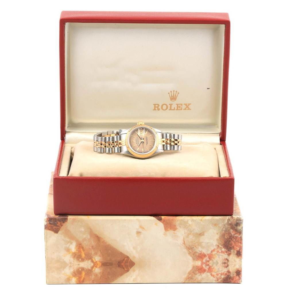 The Rolex Datejust 69173 Women's Stainless Steel Champagne Dial 69173 Women's Stainless Steel Champagne Dial watch is shown front-facing inside an open red box, with its bracelet clear.