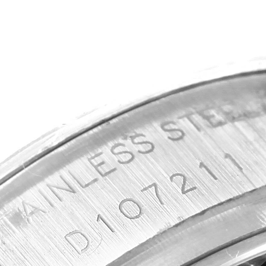 This close-up image shows the stainless steel serial number engraving on the inner rim of a Rolex Datejust 179174 Women's Stainless Steel Mother of Pearl Dial 179174 Women's Stainless Steel Mother of Pearl Dial watch.
