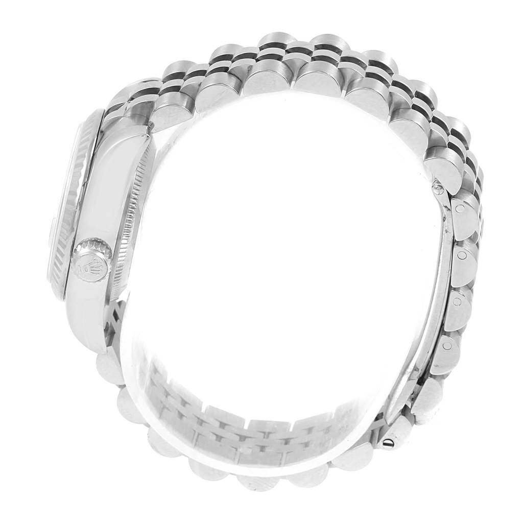 The image shows the side view of a Rolex Datejust 179174 Women's Stainless Steel Silver Dial 179174 Women's Stainless Steel Silver Dial model, focusing on its case and Jubilee bracelet.