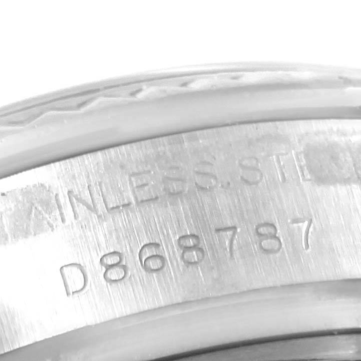 This image shows a close-up of the serial number engraved on the metal case of a Rolex Datejust 179174 Women's Stainless Steel Mother of Pearl Dial 179174 Women's Stainless Steel Mother of Pearl Dial watch.
