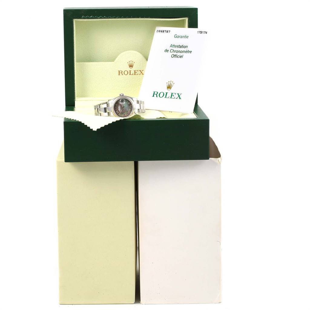 The Rolex Datejust 179174 Women's Stainless Steel Mother of Pearl Dial 179174 Women's Stainless Steel Mother of Pearl Dial watch is displayed inside its open green box with documentation shown.