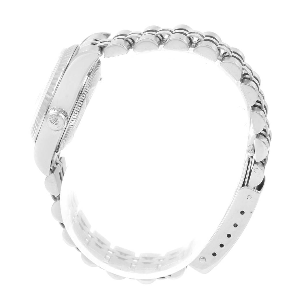 The image shows a side view of a Rolex Datejust 79174 Women
s Stainless Steel Pink Dial 79174 Women
s Stainless Steel Pink Dial watch, displaying its case, crown, and bracelet.