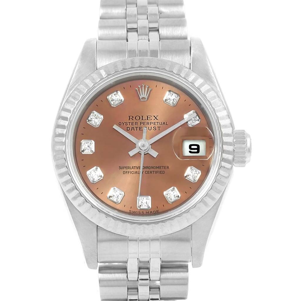 This Rolex Datejust 79174 Women
s Stainless Steel Pink Dial 79174 Women
s Stainless Steel Pink Dial watch is shown from a top-down angle, displaying its face, bezel, and part of its bracelet.