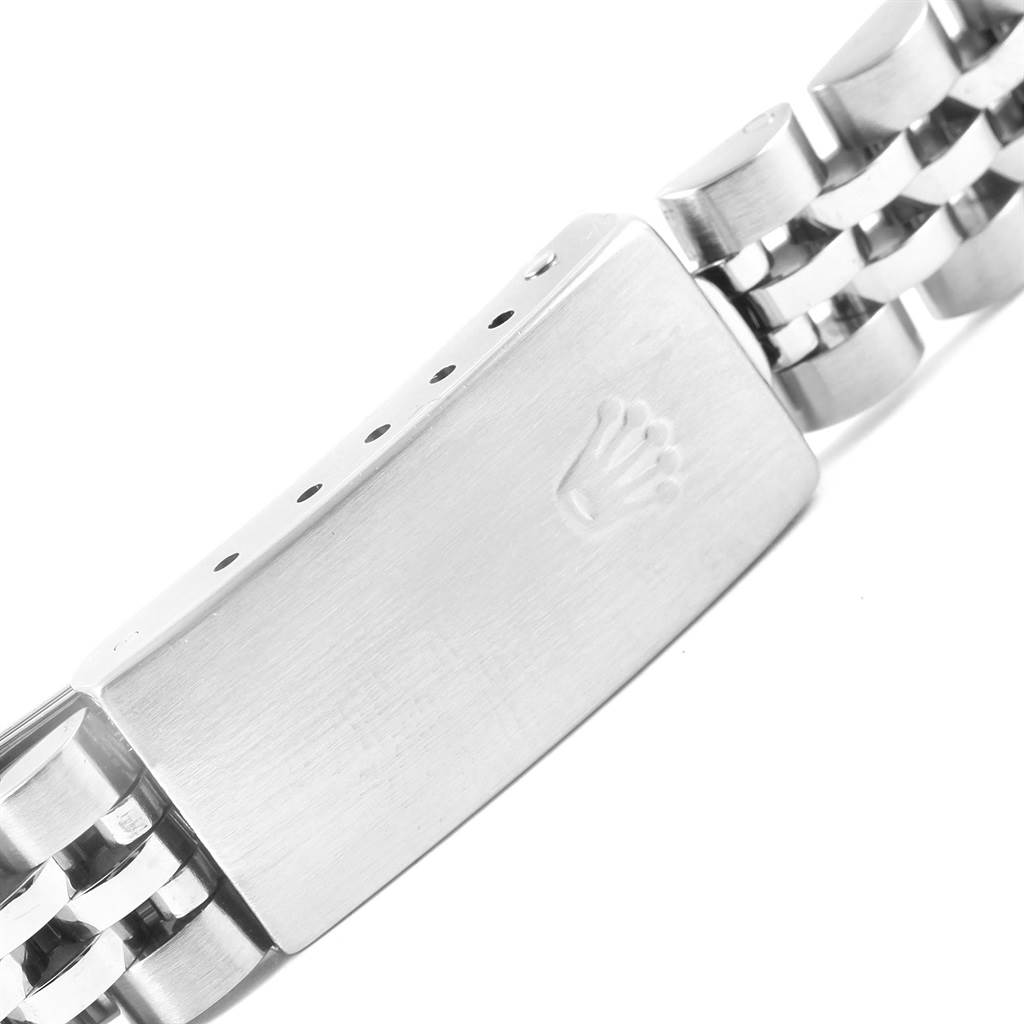 This image shows a close-up of the clasp and part of the bracelet of a Rolex Datejust 79174 Women
s Stainless Steel Pink Dial 79174 Women
s Stainless Steel Pink Dial watch.