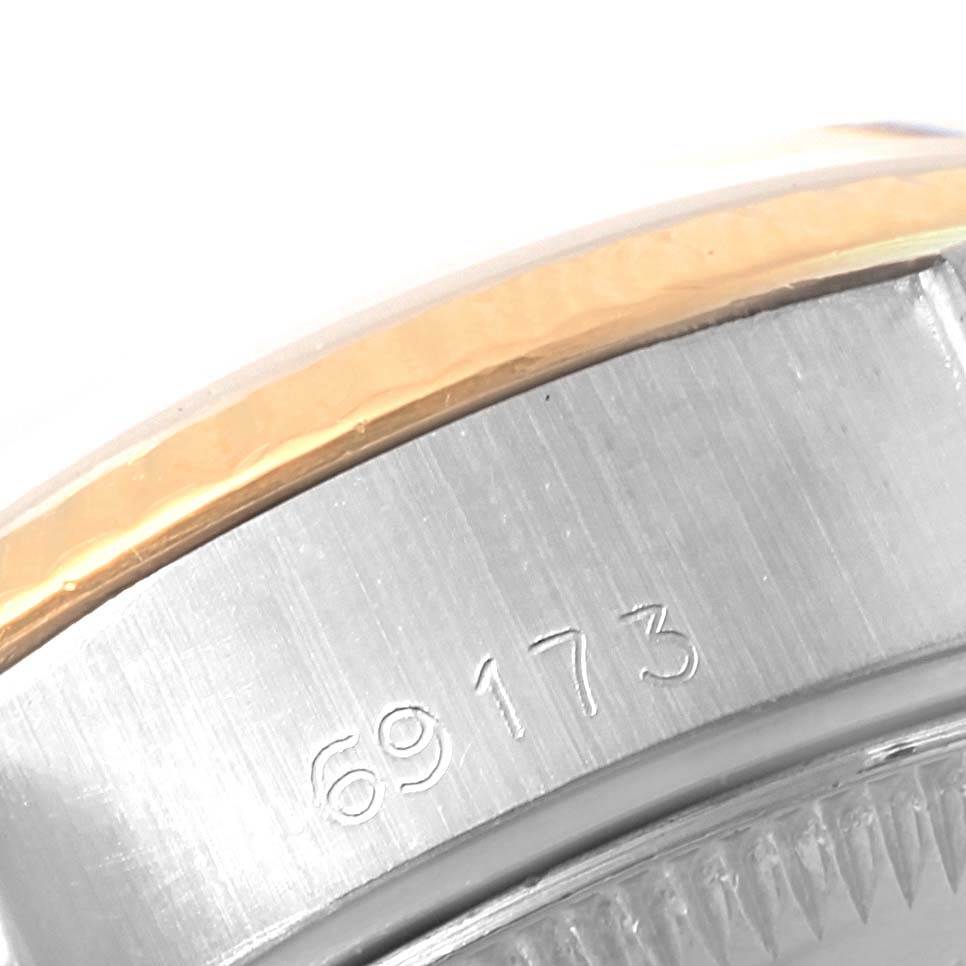 The image shows a close-up of the bezel and case with a model number of a Rolex Datejust 69173 Women's Stainless Steel White Dial 69173 Women's Stainless Steel White Dial watch.