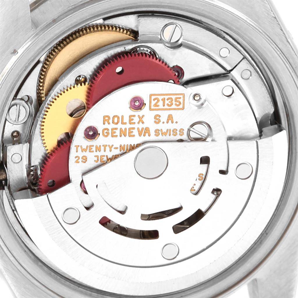 The image shows the internal mechanism of a Rolex Datejust 69174 Women's Stainless Steel Silver Dial 69174 Women's Stainless Steel Silver Dial watch, including gears and movements, viewed from the back.