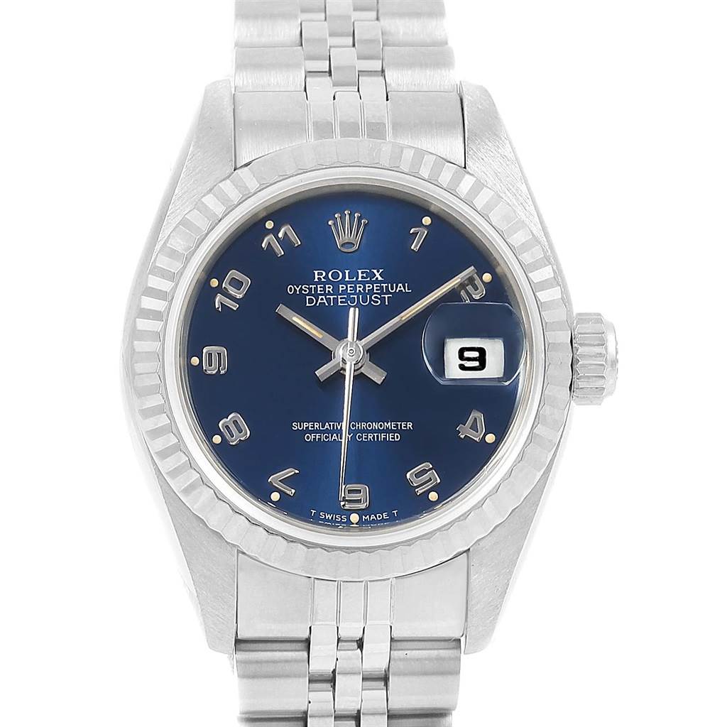 The image shows a top-down view of the Rolex Datejust 69174 Women's Stainless Steel Blue Dial 69174 Women's Stainless Steel Blue Dial watch, highlighting its blue dial, fluted bezel, and metal bracelet.