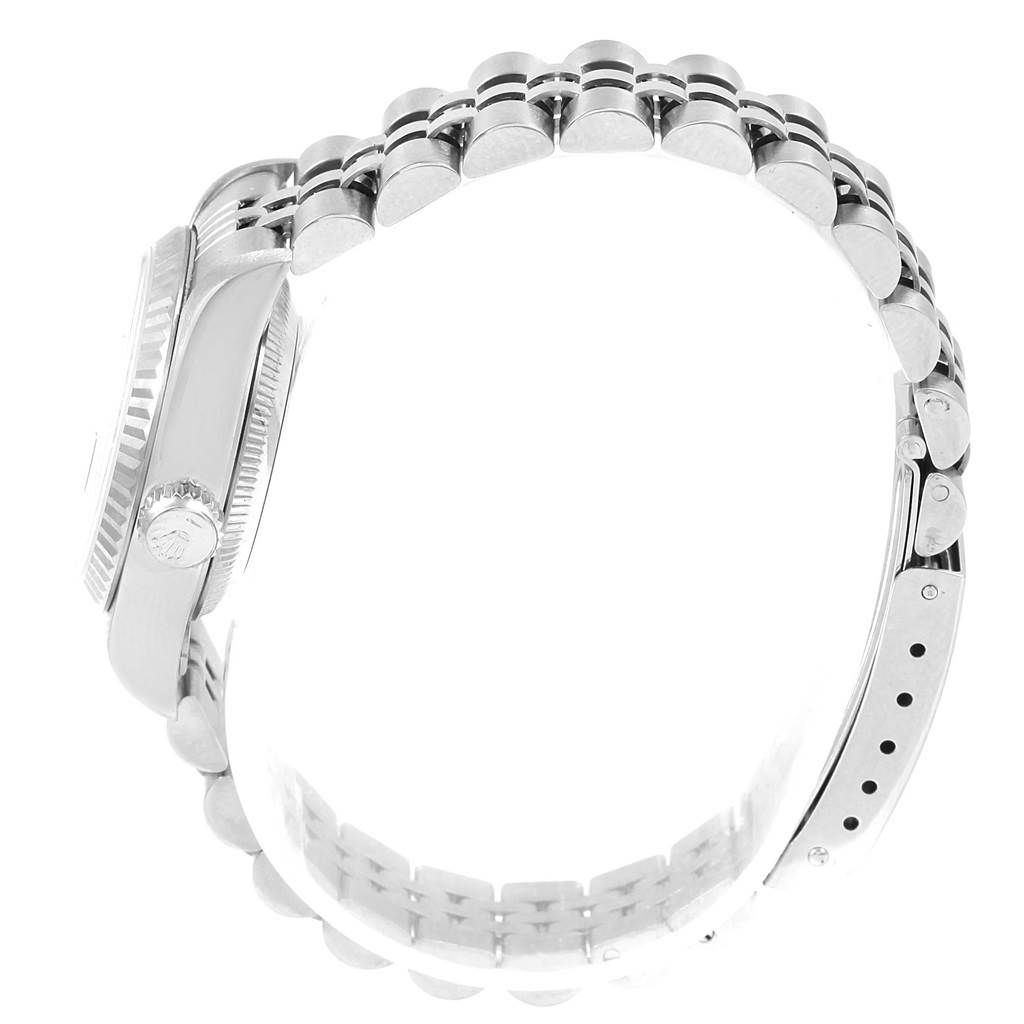 The image shows a side view of a Rolex Datejust 69174 Women's Stainless Steel Blue Dial 69174 Women's Stainless Steel Blue Dial watch, focusing on the case, crown, and bracelet.