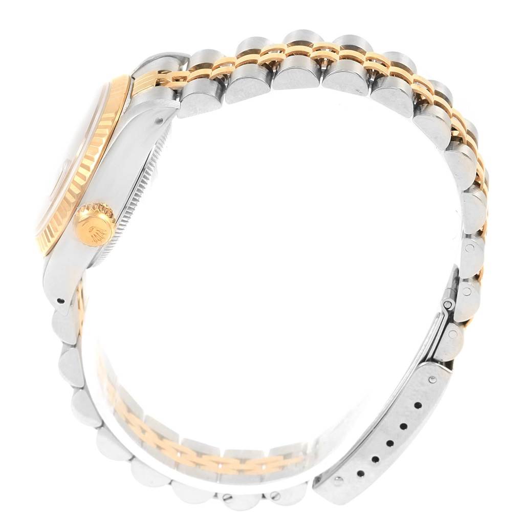 The image shows a side and partial top view of the Rolex 69173 Men's Stainless Steel Champagne Dial 69173 Men's Stainless Steel Champagne Dial Datejust 69173, highlighting the steel and yellow gold bracelet and case.