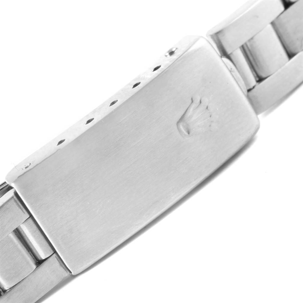 This image shows the clasp of a Rolex Datejust 79174 Women's Stainless Steel Silver Dial 79174 Women's Stainless Steel Silver Dial watch, highlighting the engraved logo and part of the bracelet.