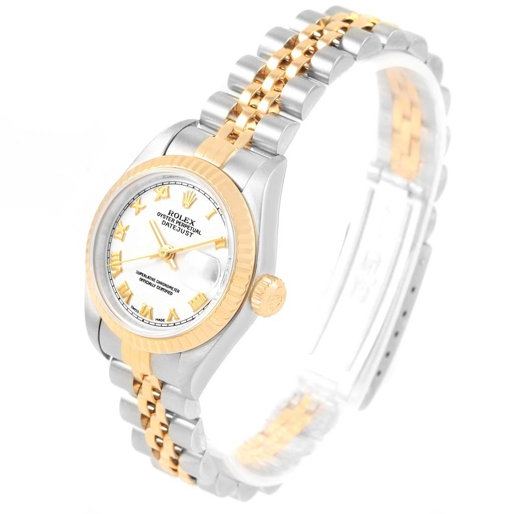 The Rolex Datejust 79173 Women's Steel and Gold (two tone) White Dial 79173 Women's Steel and Gold (two tone) White Dial watch is shown from an angled side view, displaying its face, bezel, crown, and two-tone bracelet.