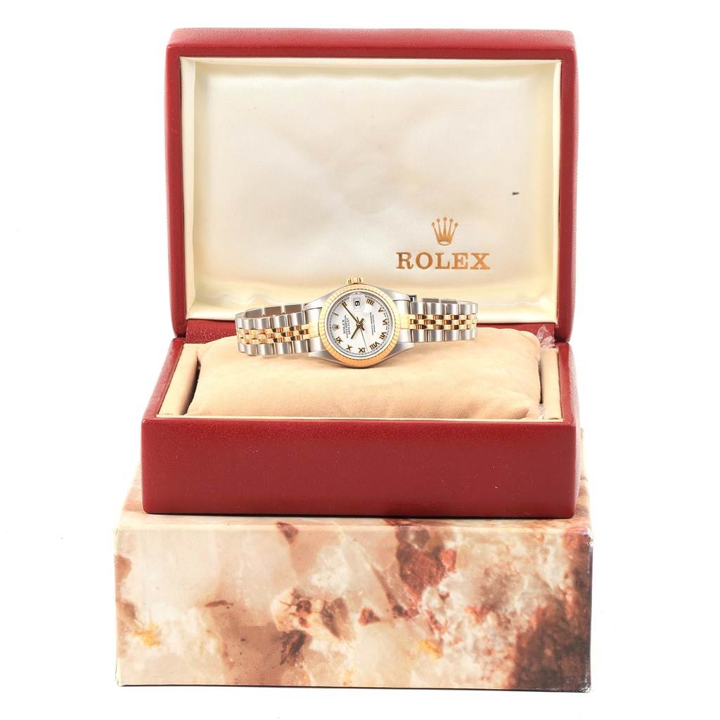 The image shows a Rolex Datejust 79173 Women's Steel and Gold (two tone) White Dial 79173 Women's Steel and Gold (two tone) White Dial watch, displayed in an open, red Rolex box from a front-facing angle.