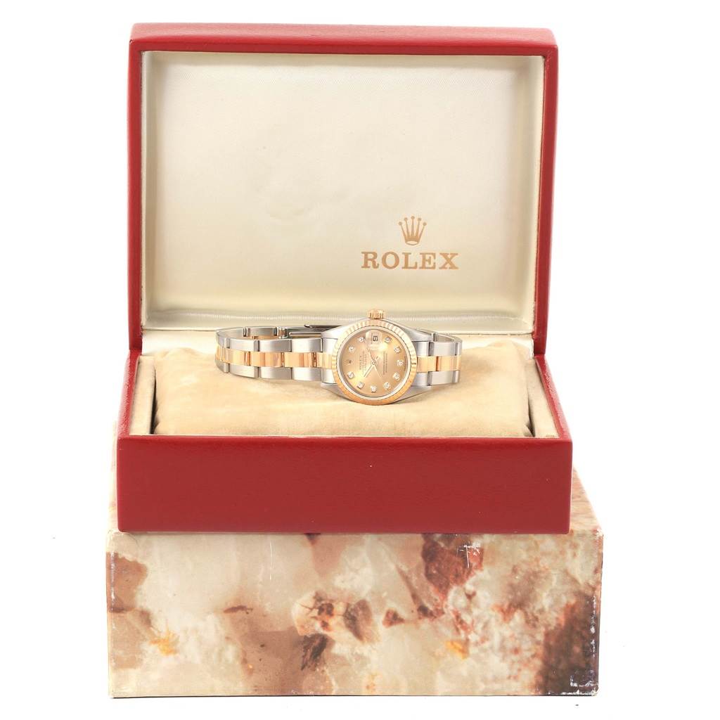 The Rolex Datejust 69173 Women's Stainless Steel Champagne Dial 69173 Women's Stainless Steel Champagne Dial watch is shown at a front angle inside a red presentation box.