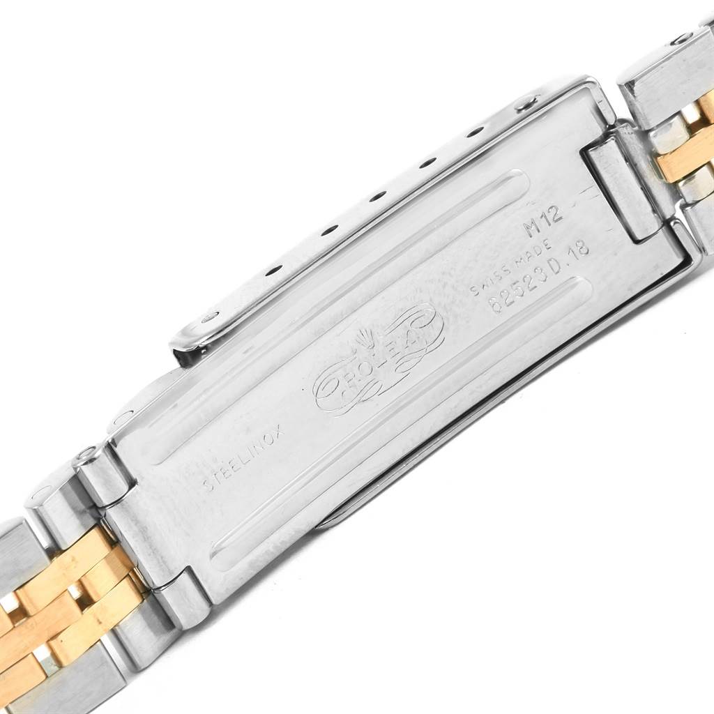 The image shows the clasp of a Rolex Datejust 69173 Women's Steel and Gold (two tone) Blue Dial 69173 Women's Steel and Gold (two tone) Blue Dial watch band, featuring the branding and serial number.