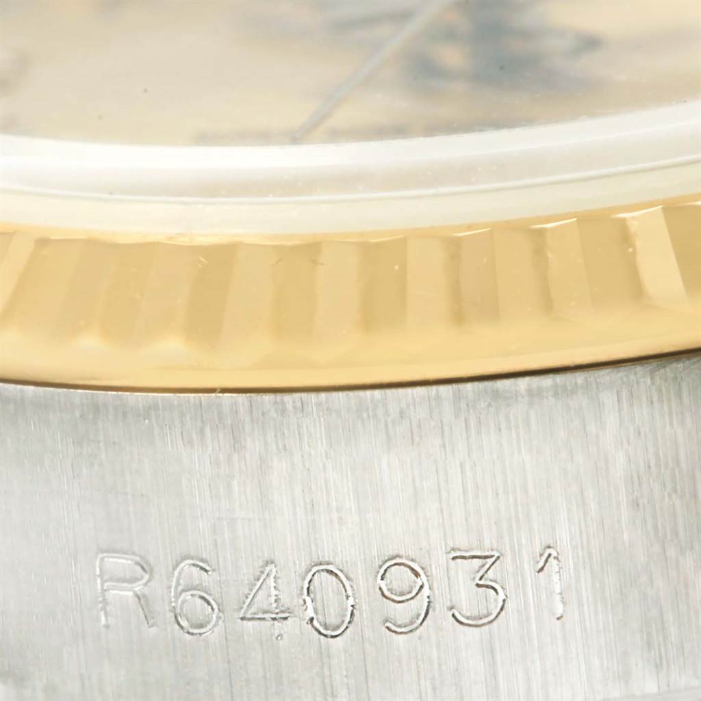 Close-up of the serial number and bezel of a Rolex Datejust 69173 Women's Steel and Gold (two tone) Blue Dial 69173 Women's Steel and Gold (two tone) Blue Dial watch.