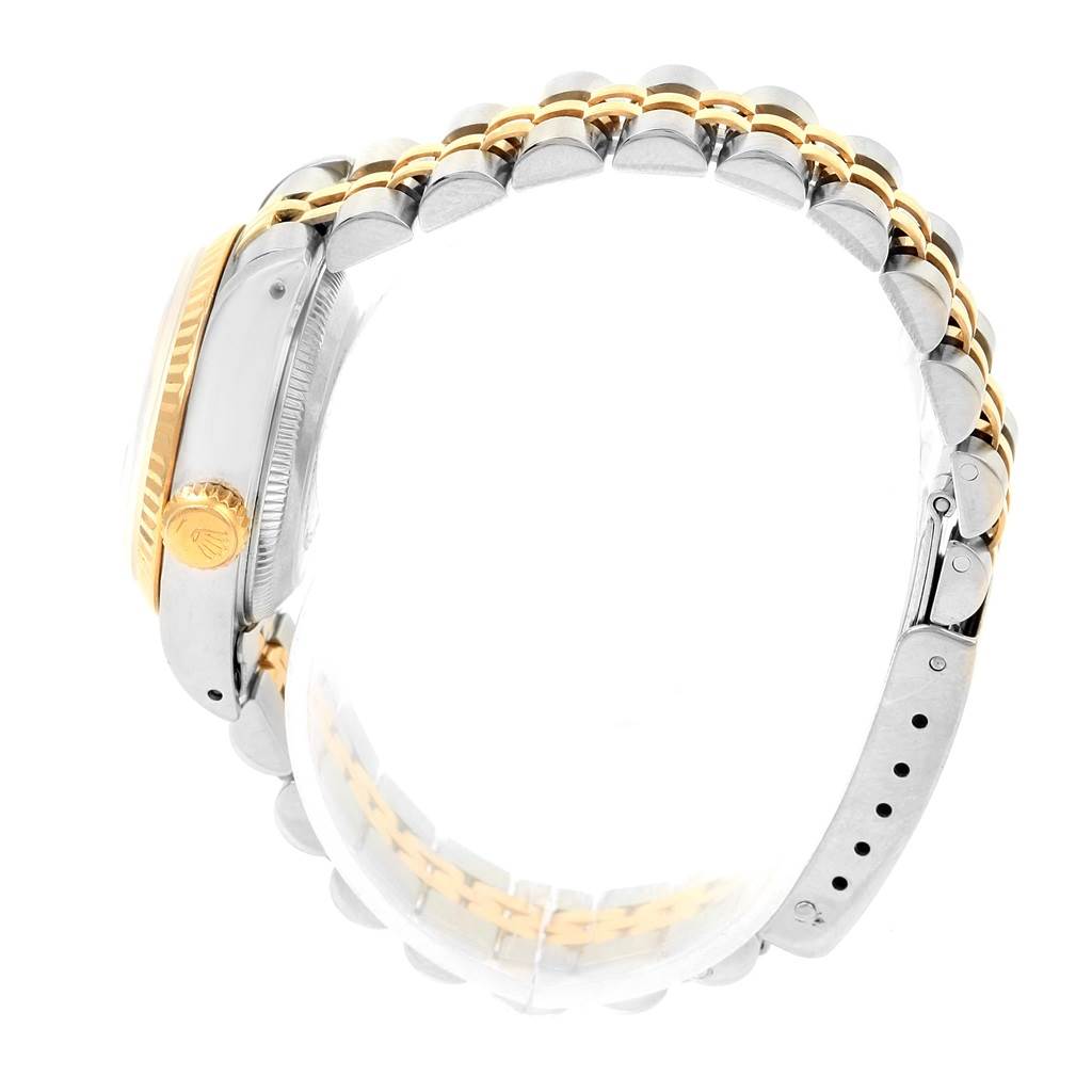 This image displays a side view of the case and bracelet of a Rolex Datejust 69173 Women's Steel and Gold (two tone) Blue Dial 69173 Women's Steel and Gold (two tone) Blue Dial watch, focusing on the crown and jubilee bracelet.